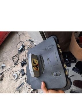 Nintendo Black N64 Console with Inserted Game Cartridge